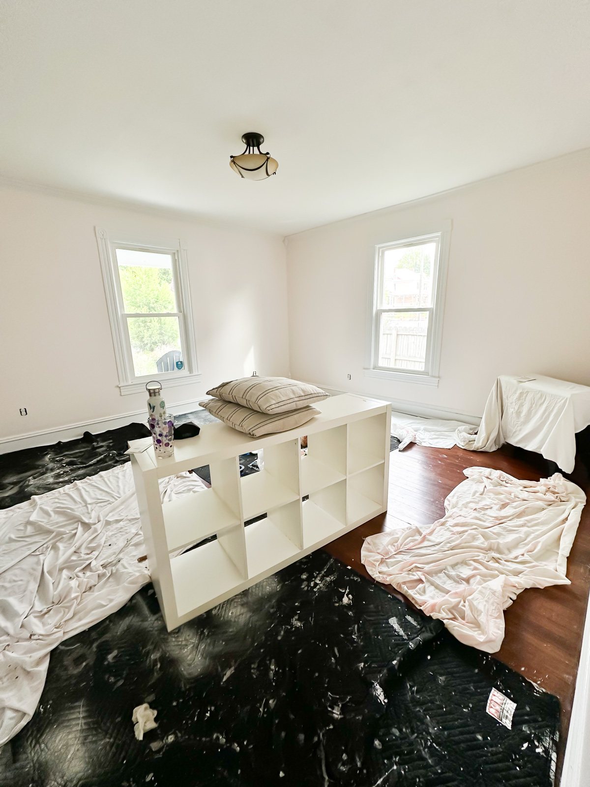 living room walls after one coat of primer and two coats of paint.
