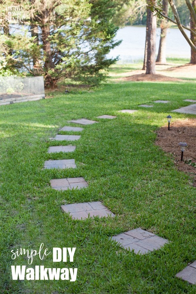 How to lay a paver stone walkway that is easy to make in an afternoon. Plus since it is level with the grass, a lawnmower can go over it making it easy to maintain.