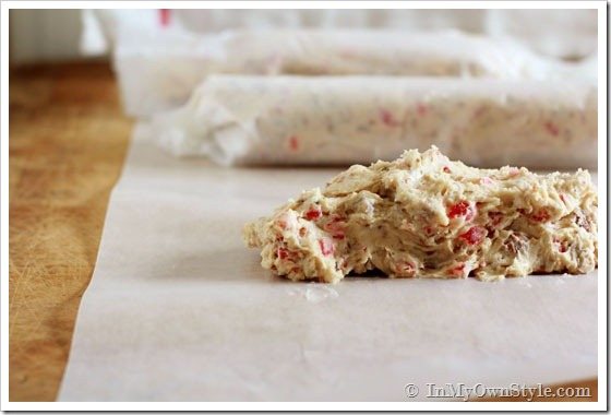 Cookie dough is rolled into logs to place in the fridge.