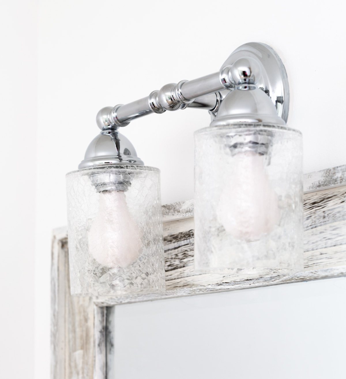 crackle glass and polished chrome bathroom light fixture.
