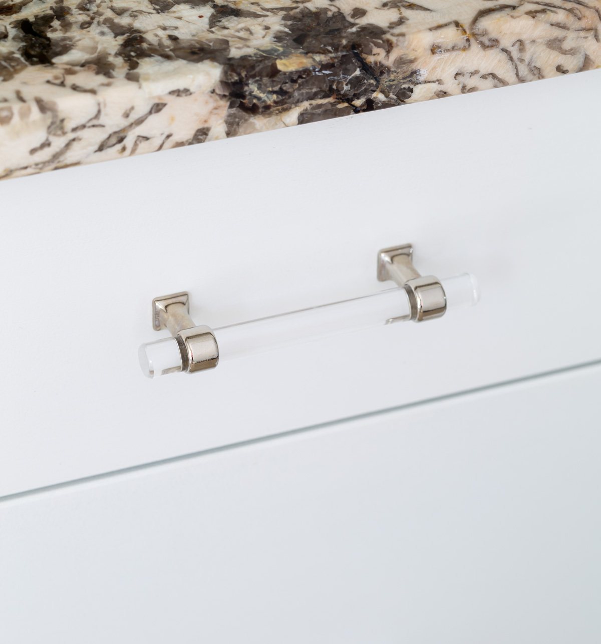 polished chrome and lucite cabinet drawer pull on vanity