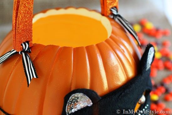 close up of ribbon ties holding handles onto pumpkin.