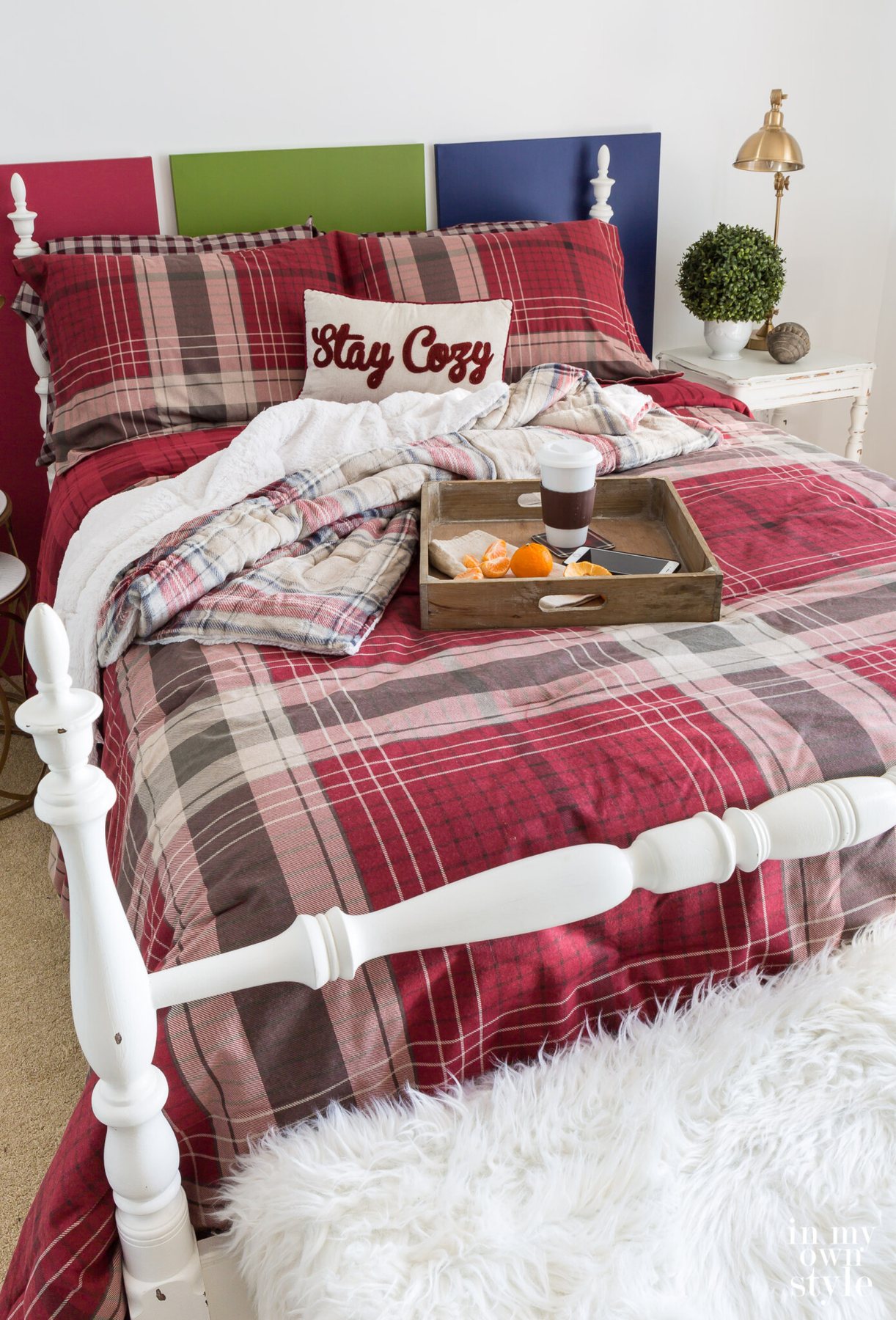 CuddlDuds Red plaid comforter and shams on a bed.