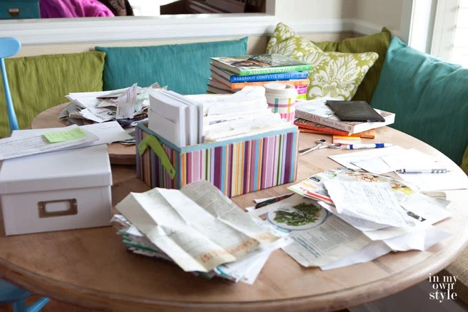 Recipe-box-organizing process on kitchen table.