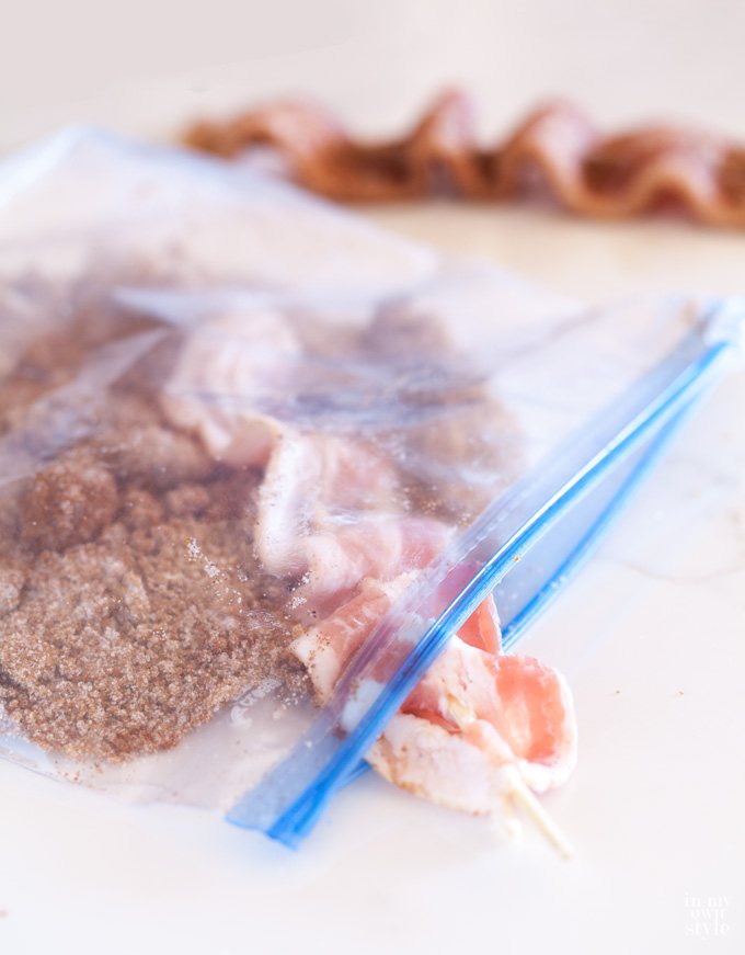 Spicy Bacon Skewers being made and placed in baggie to be coated.