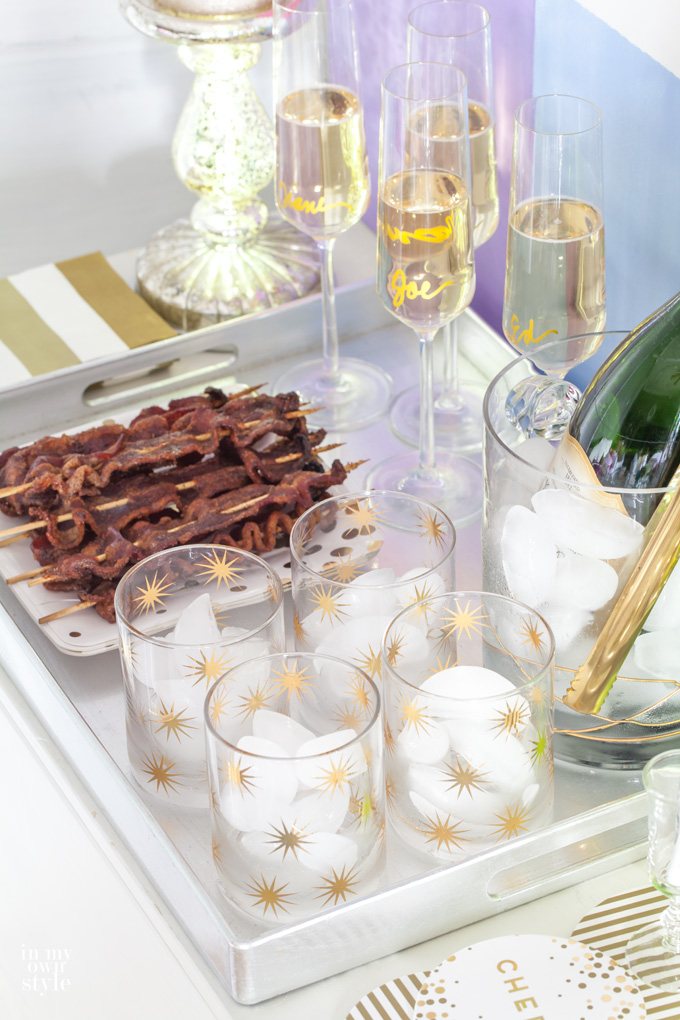 Bar Cart and Tray set up with glassware and spiced bacon skewers.