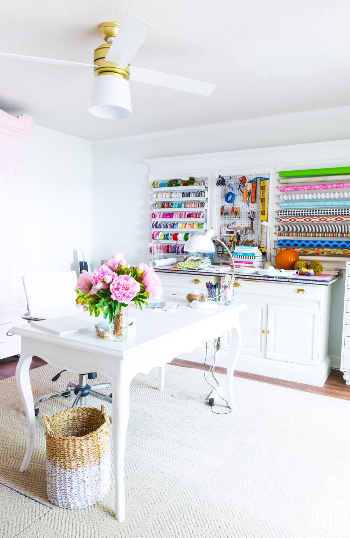 Craft room with Hunter Hepburn ceiling fan with lampshade to replace broken glass globe.