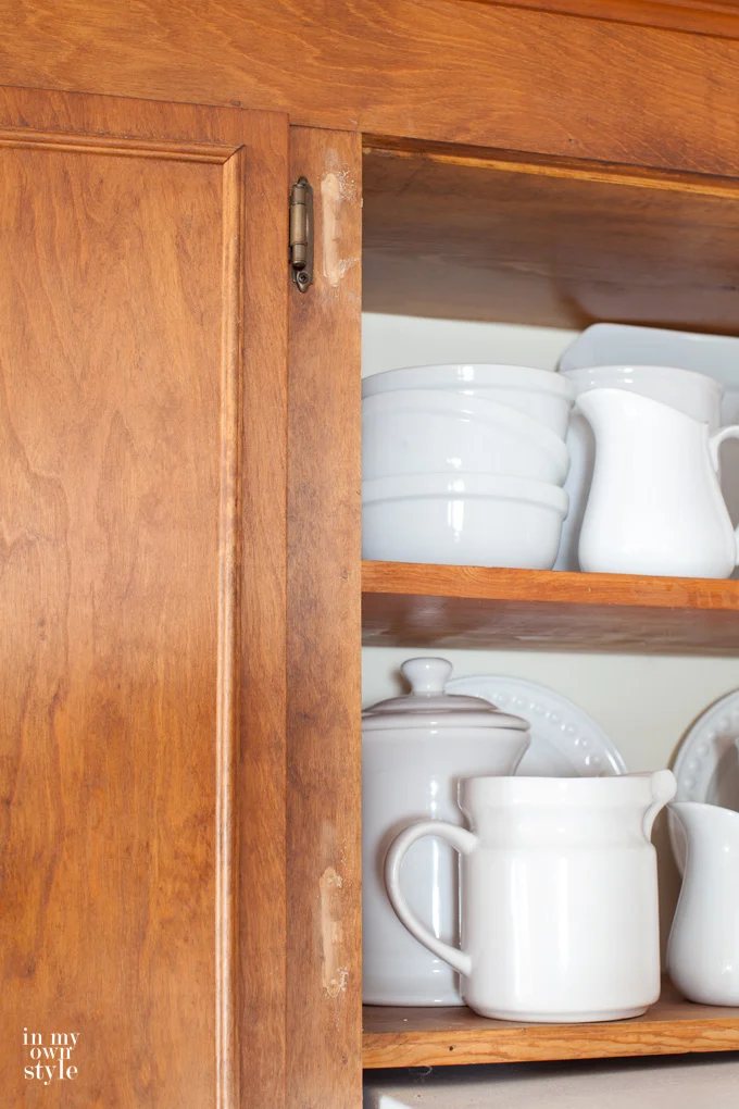 how to fix hinge holes on a stained cabinet.
