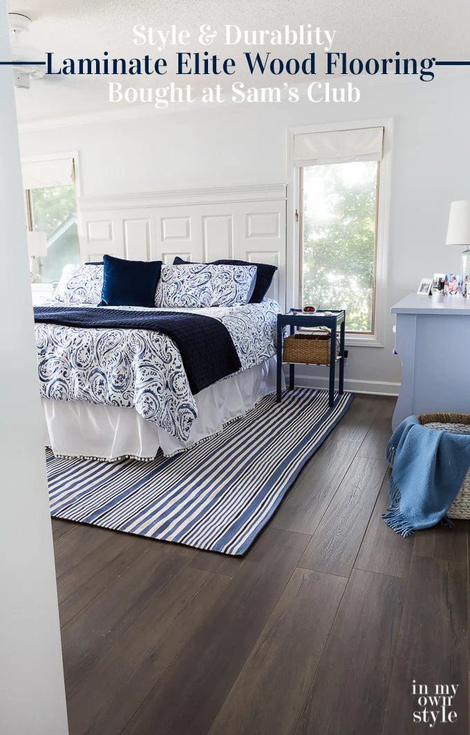 After photo showing how new wood laminate flooring looks in blue and white bedroom