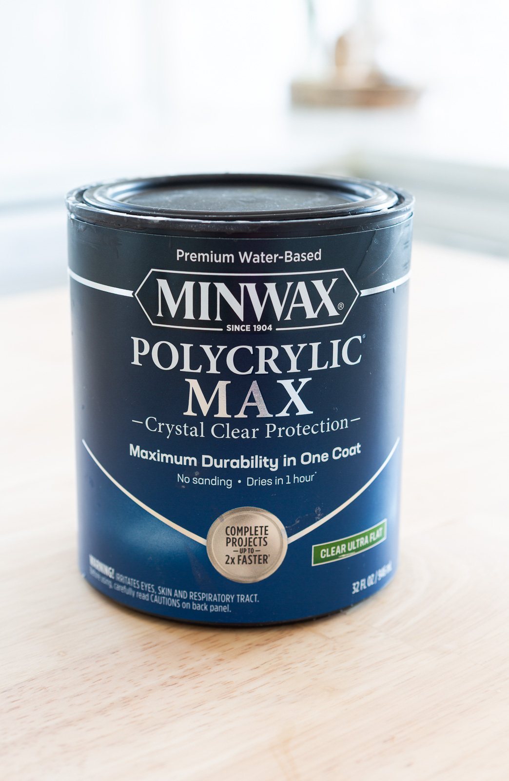 A quart can of Minwax Polycrylic Max on top wood counter.
