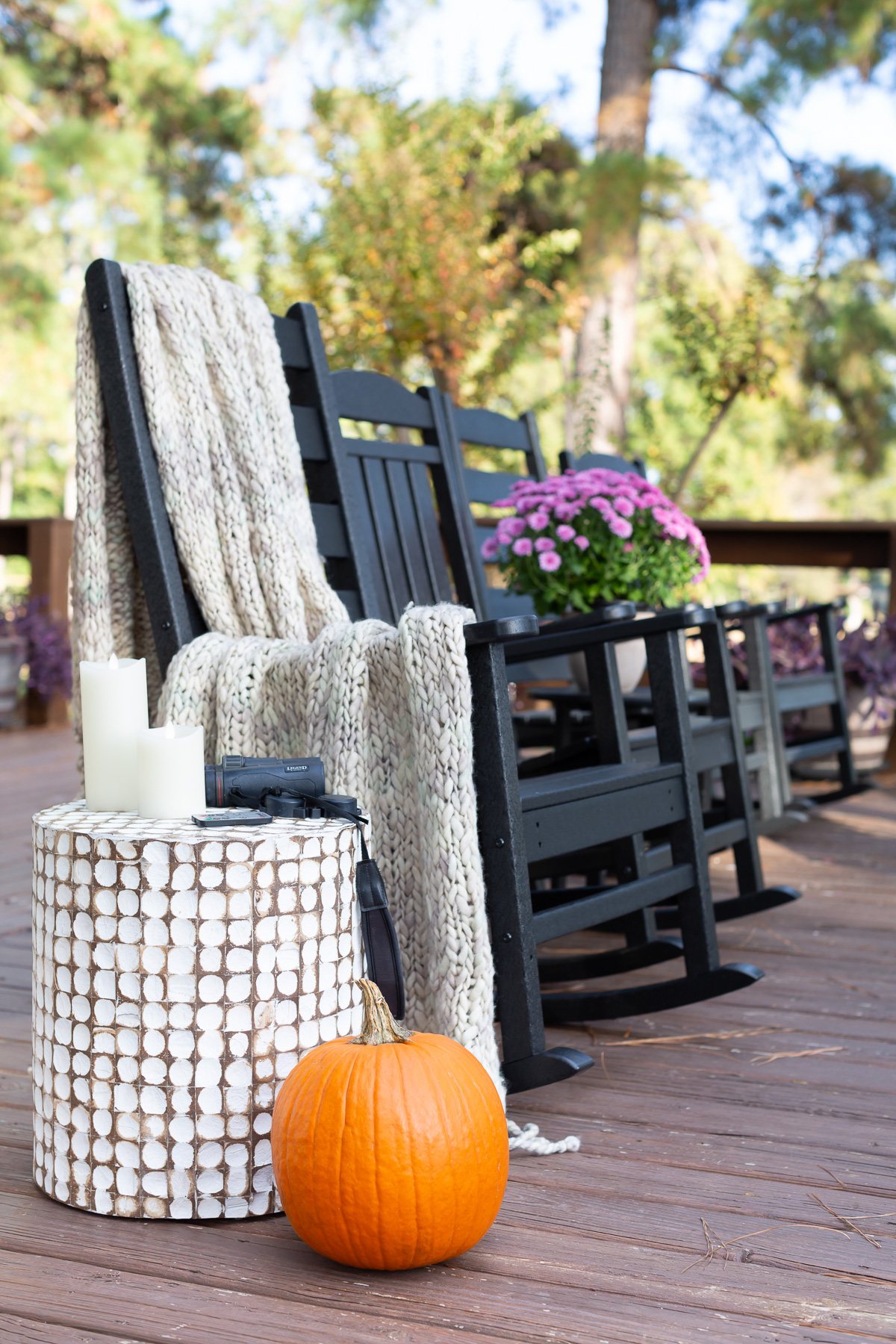 cozy fall on the deck line up of black Polywood rocking chairs