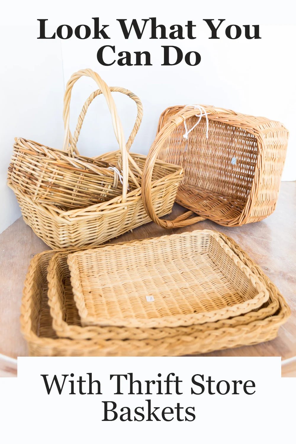 a collection of natural wicker baskets spread out on a table.