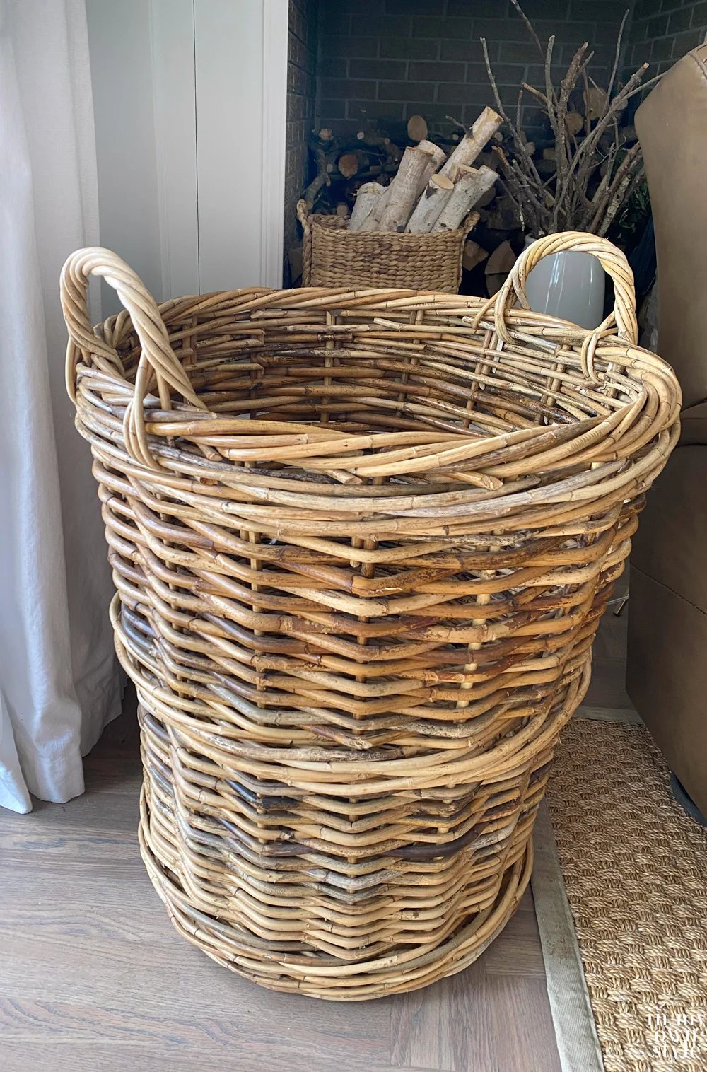 Large wicker basket with handles ready to make into a unique side table for an arm chair.