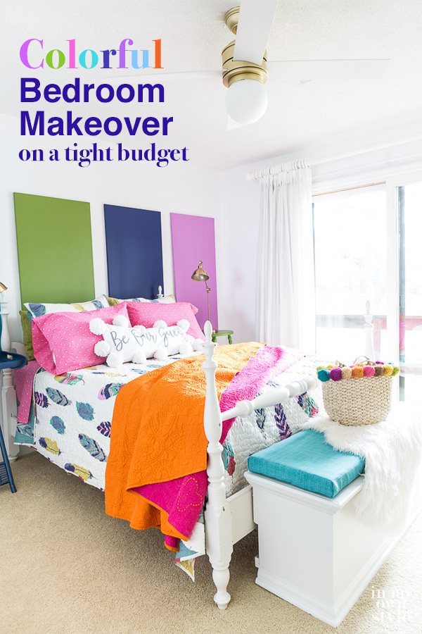 Colorful guest bedroom with white walls and pops of vivid color throughout the room.