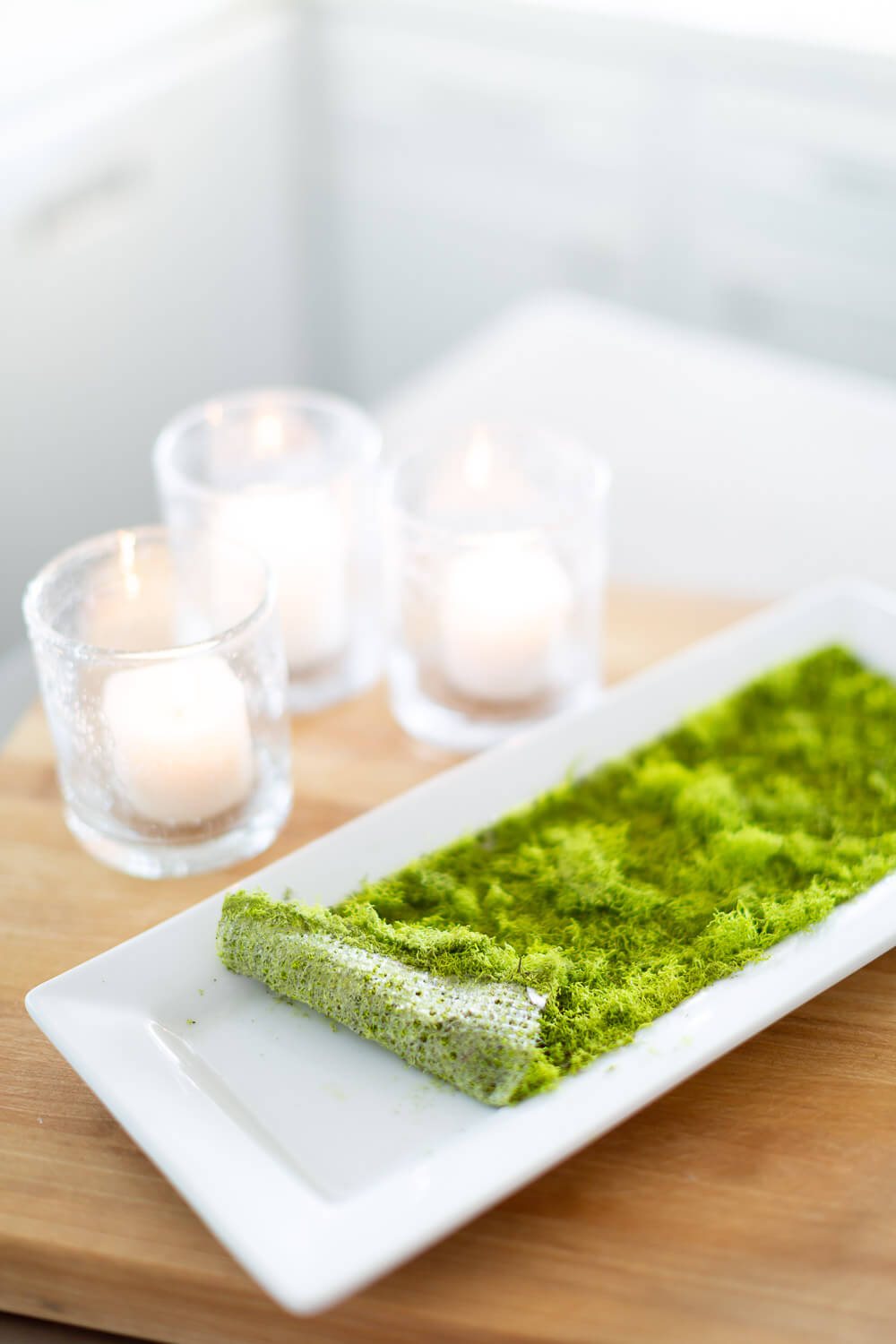 Sticky moss sheet used to create a spring candle tray centerpiece without flowers.