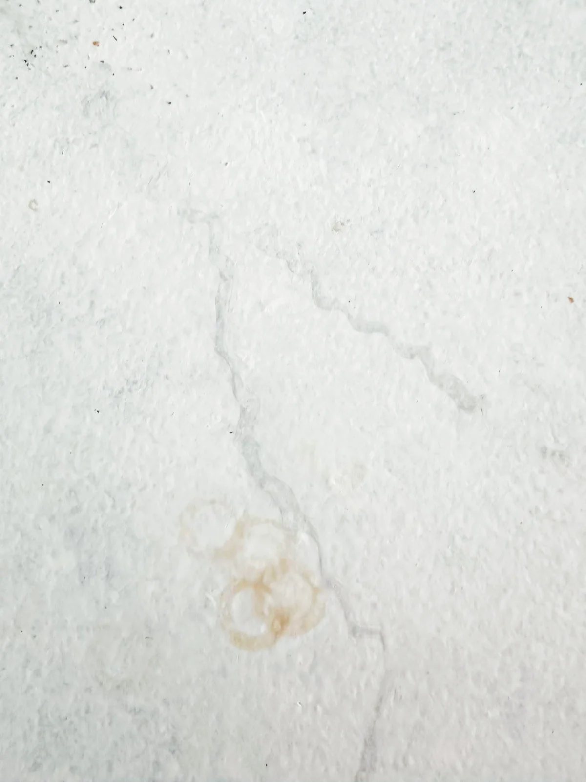close up of staining on painted kitchen countertops