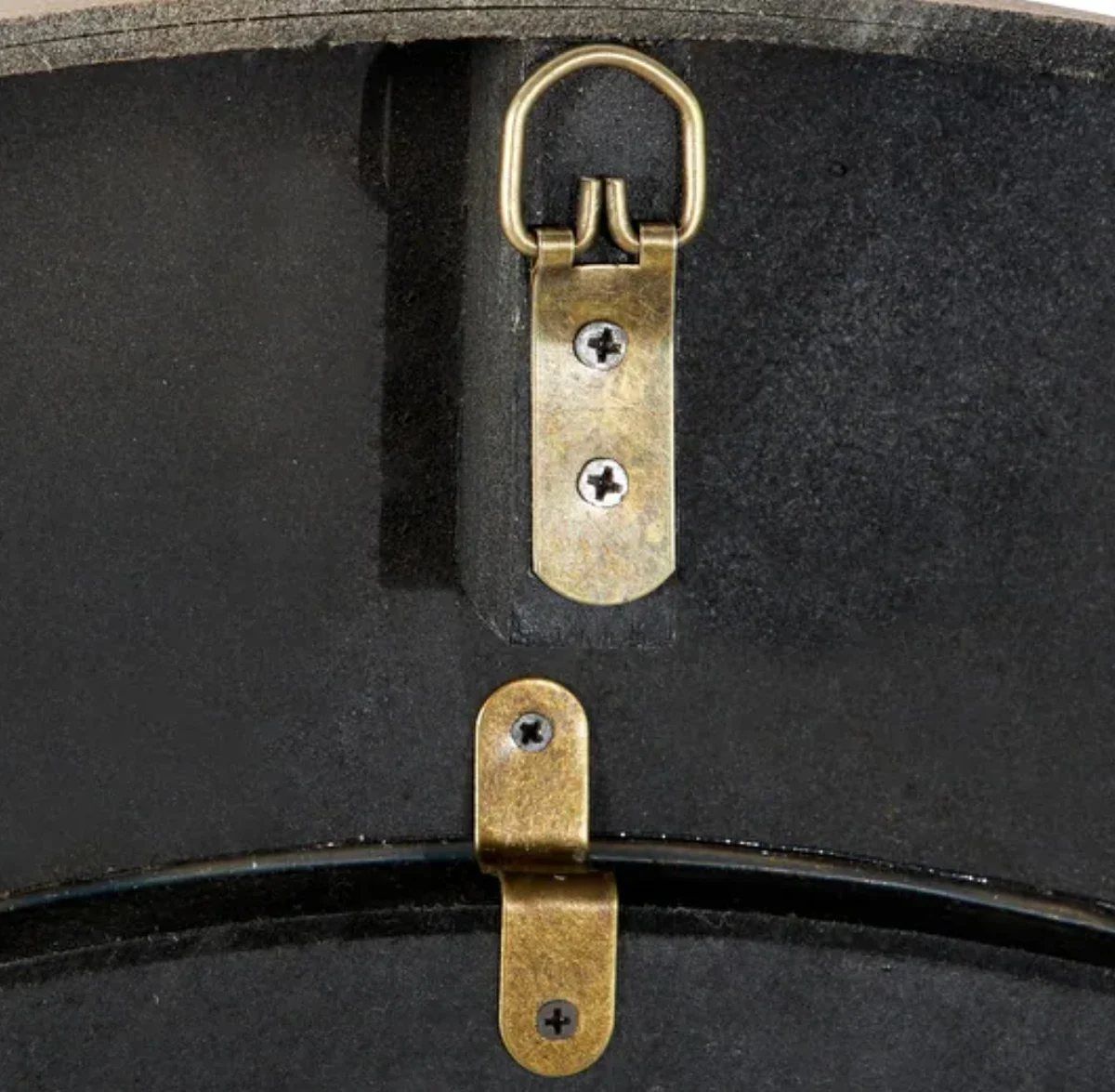 Brass hanger on the back of a large wall clock