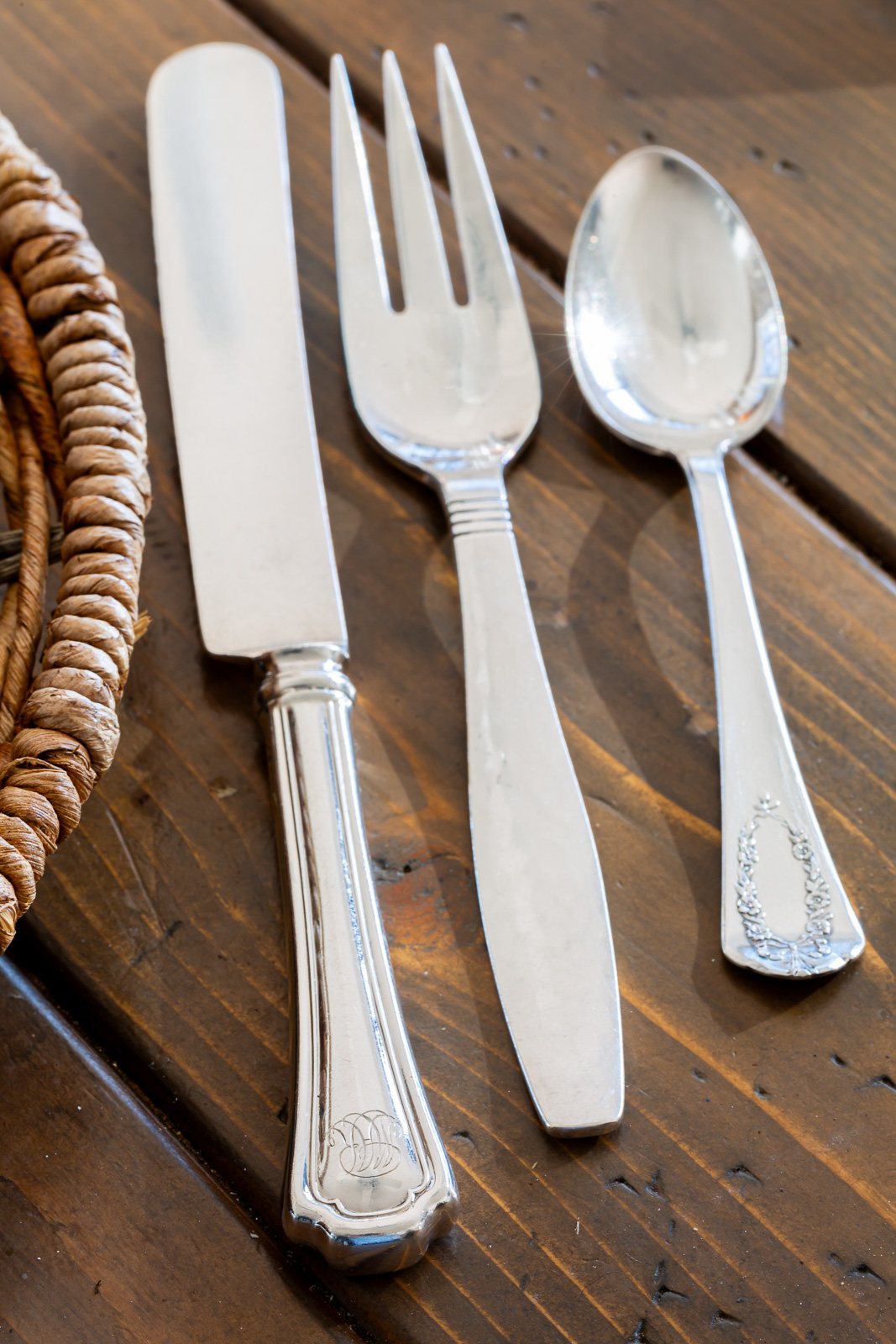 a mix of sterling at a table setting