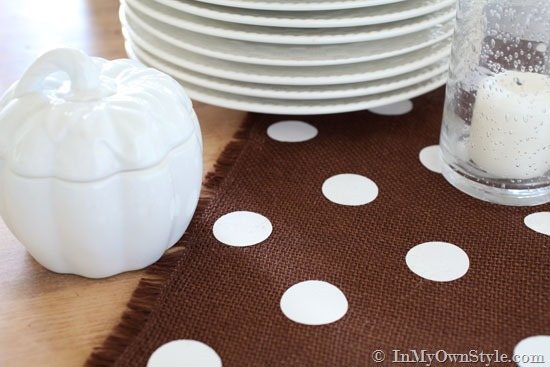 White Polka dot on brown burlap fringed table runner.