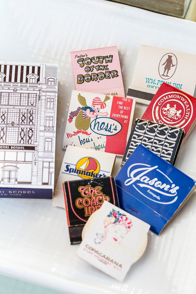 Collection of matchbooks on a pretty plate on a coffee table. Use What You Have Home Decorating Ideas