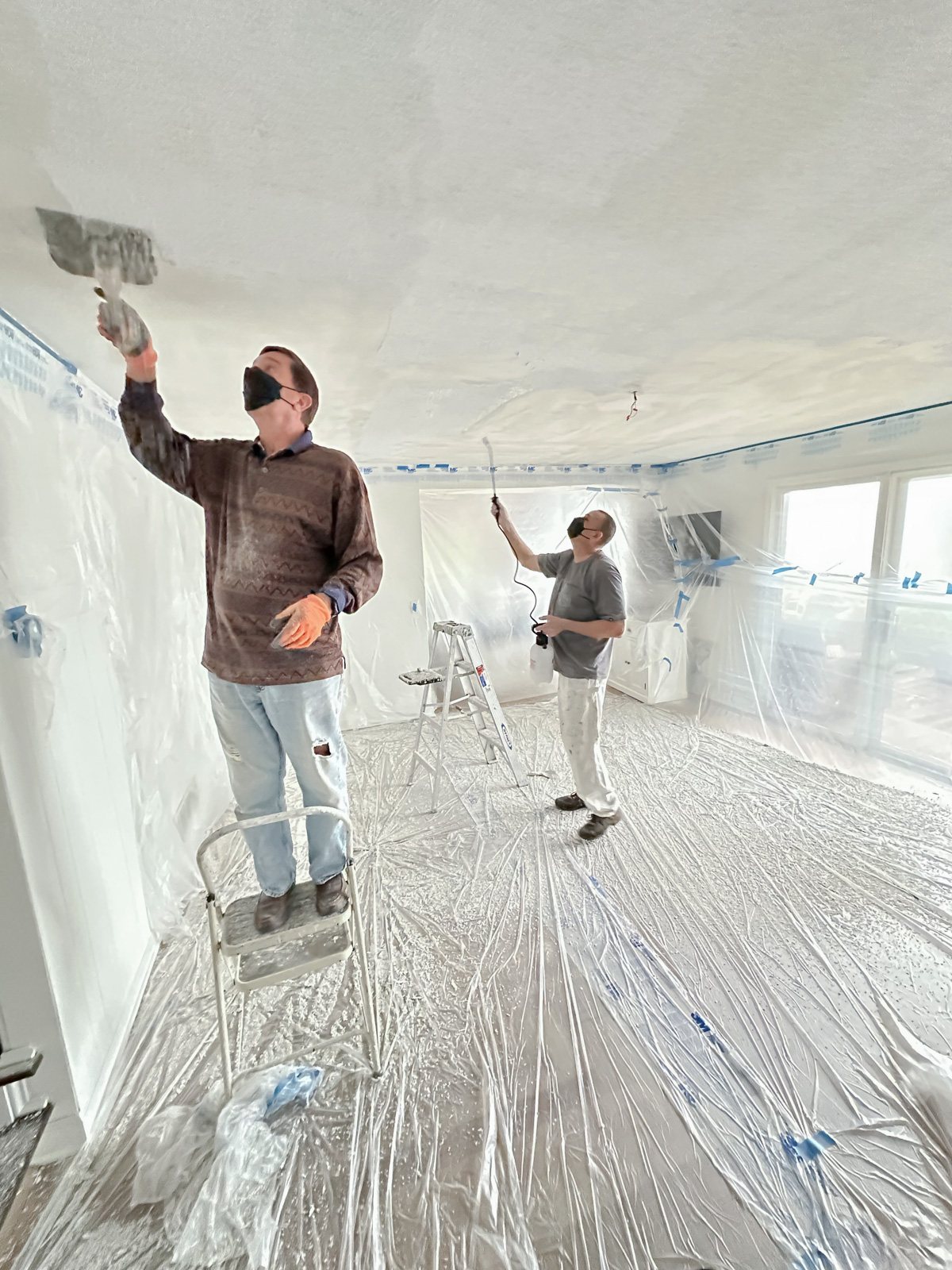 Homeowner removing popcorn ceiling.