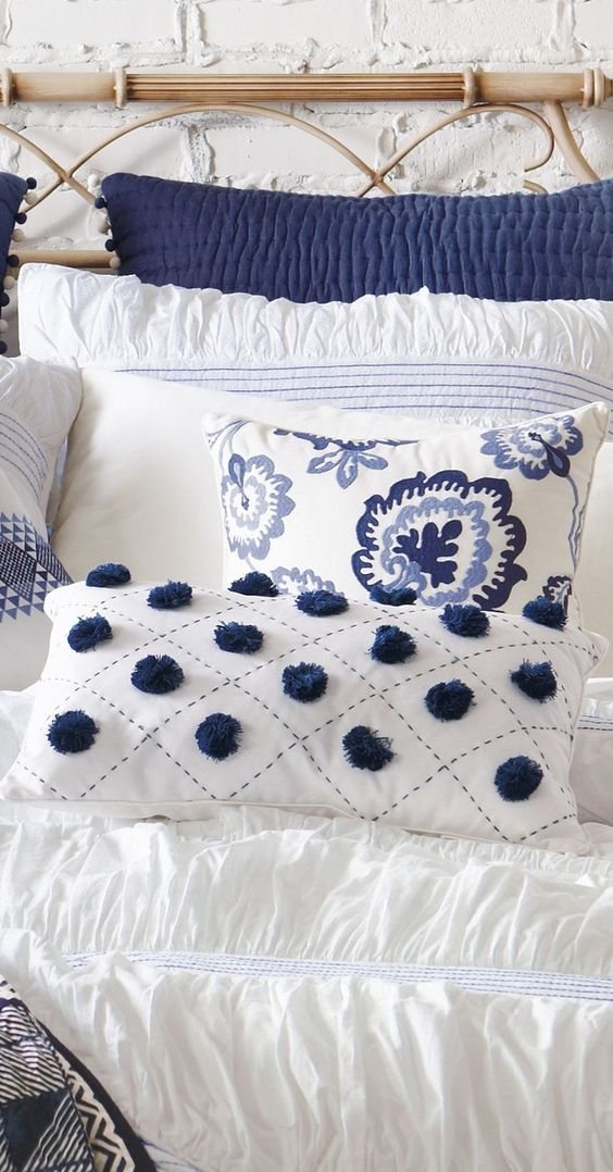 navy blue and white bedroom pillows