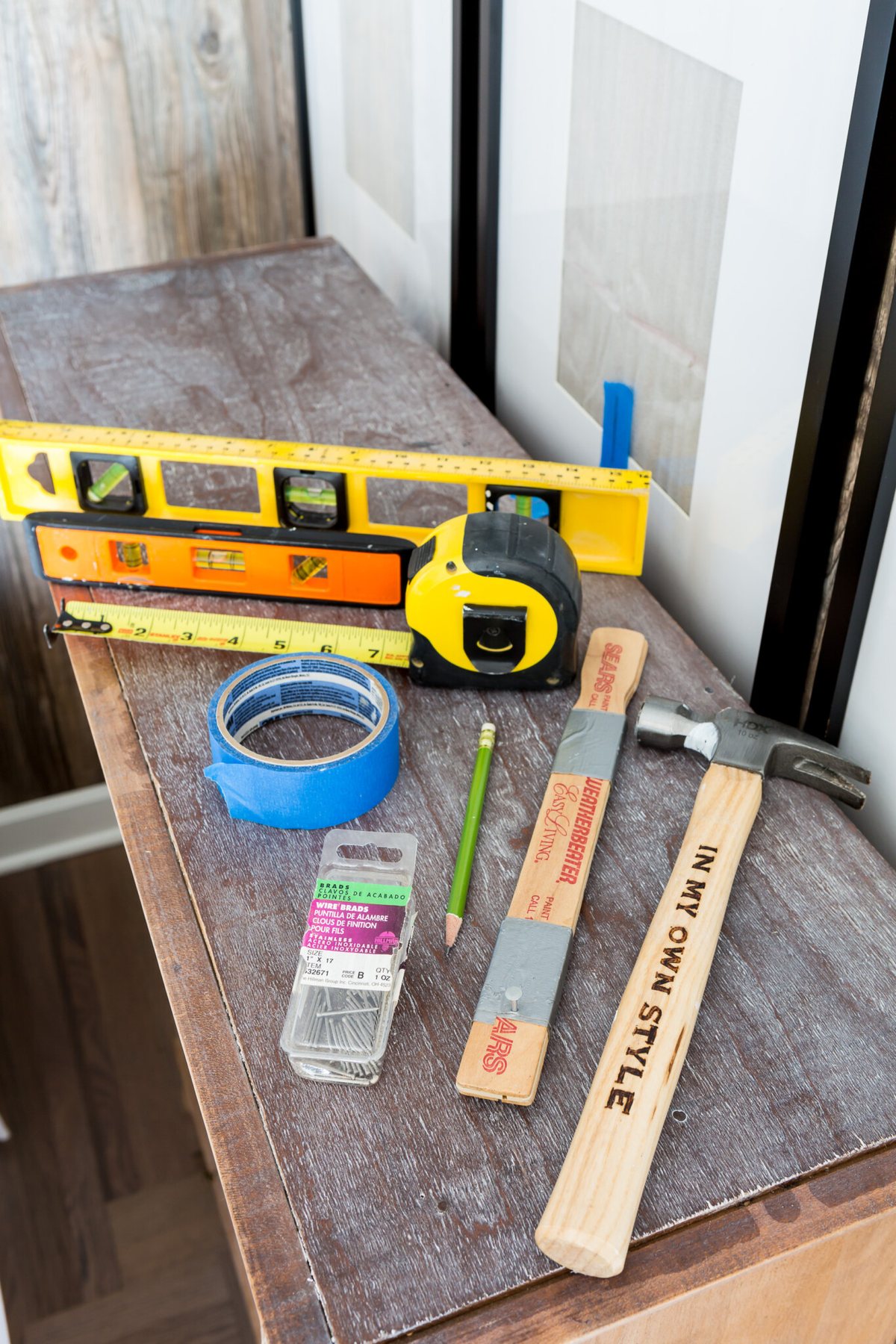 tools needed to hang a photo gallery on a wall