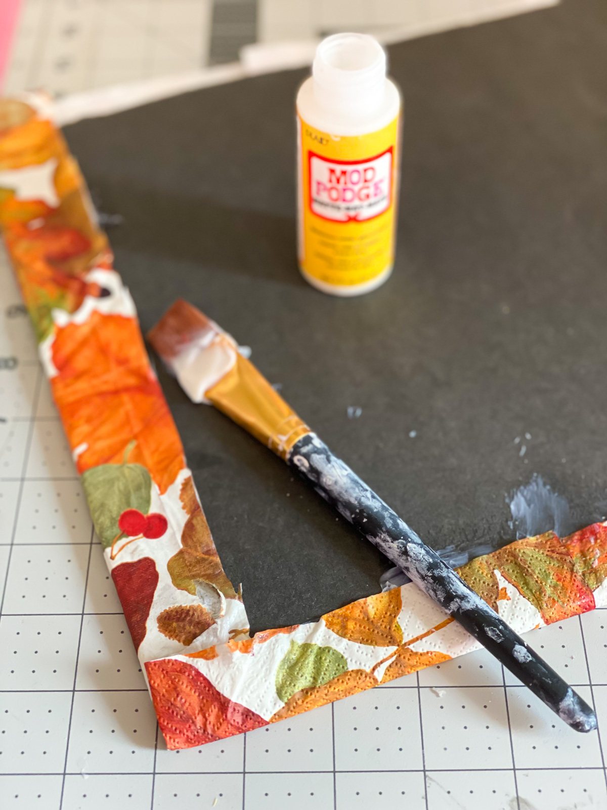 how to secure paper napkins or gift wrap to the back of foam core or cardboard