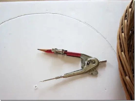 use a compass to cut board into a circle shape