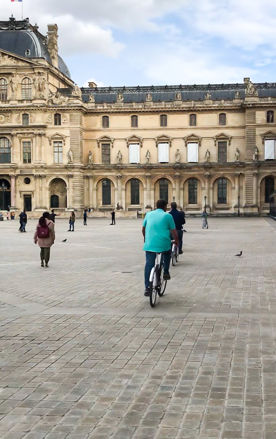 Bike tours in Paris that take you to the courtyard of the Louvre in Paris France