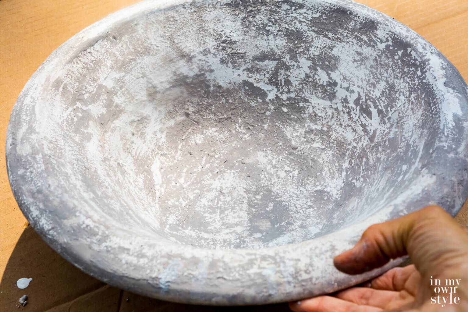 Inside of Pottery Barn Bowl with a painted aged finish to resemble concrete.