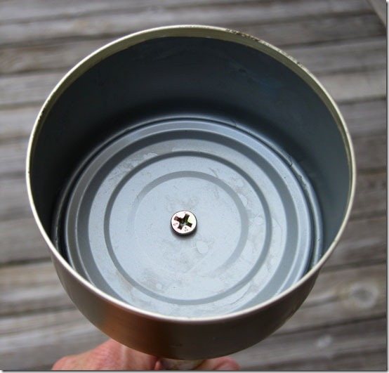 Can-screwed-on to pole to make outdoor lantern made using a tuna can.