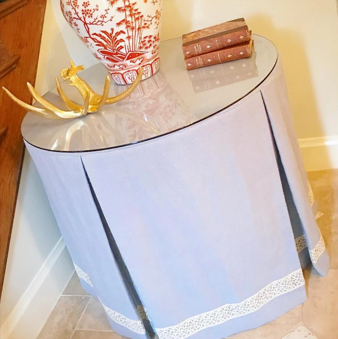 A pleated drum style skirted table.