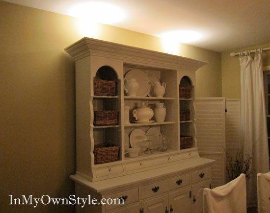 How to add lighting to the top of a dining room china cabinet