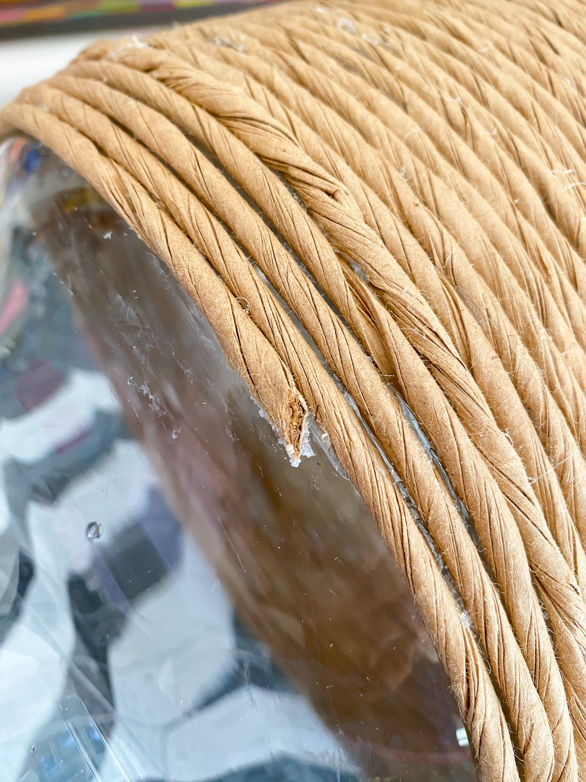 paper cord wrapped around glass vase