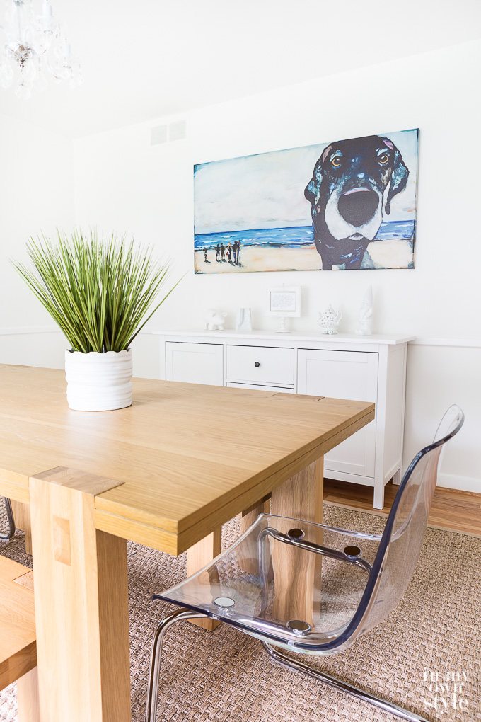 Dining room with dog art on wall