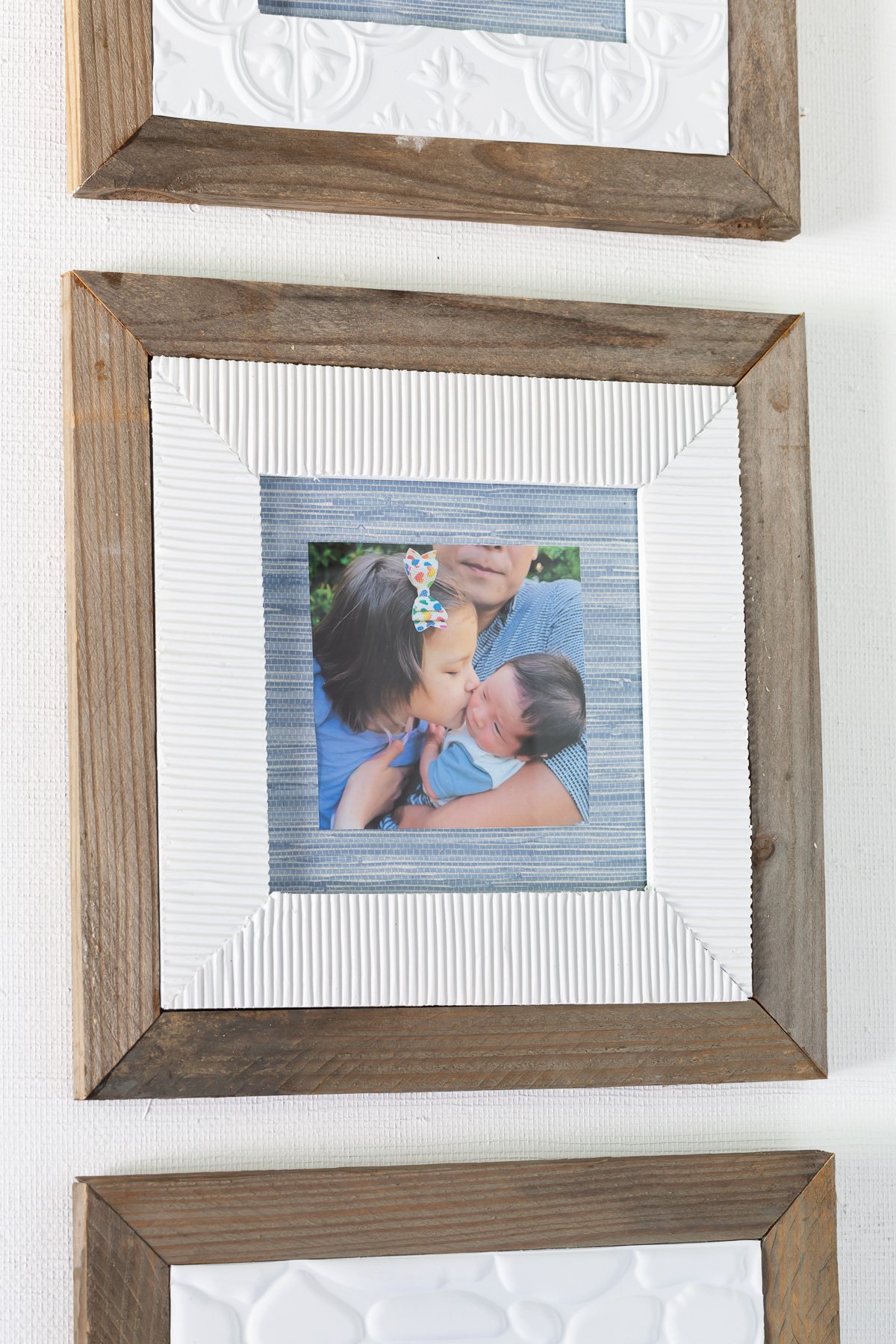 Close up of old picture frame makeovers using wood and corrugated cardboard.
