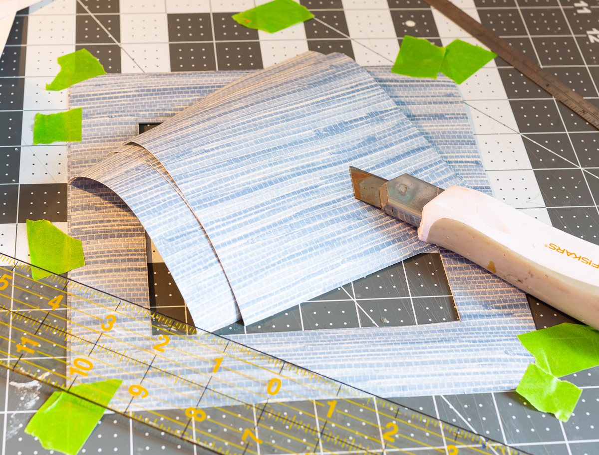 cut wallpaper to use as a DIY picture frame mat.