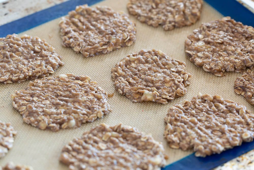 Flattened banana oatmeal cookies ready for baking.