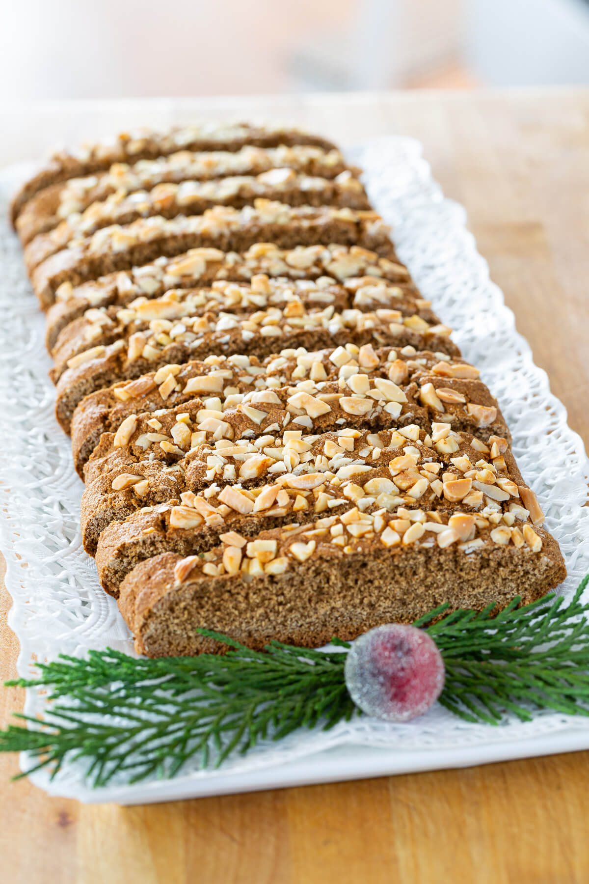 A serving place with sliced gingerbread biscotti on it.