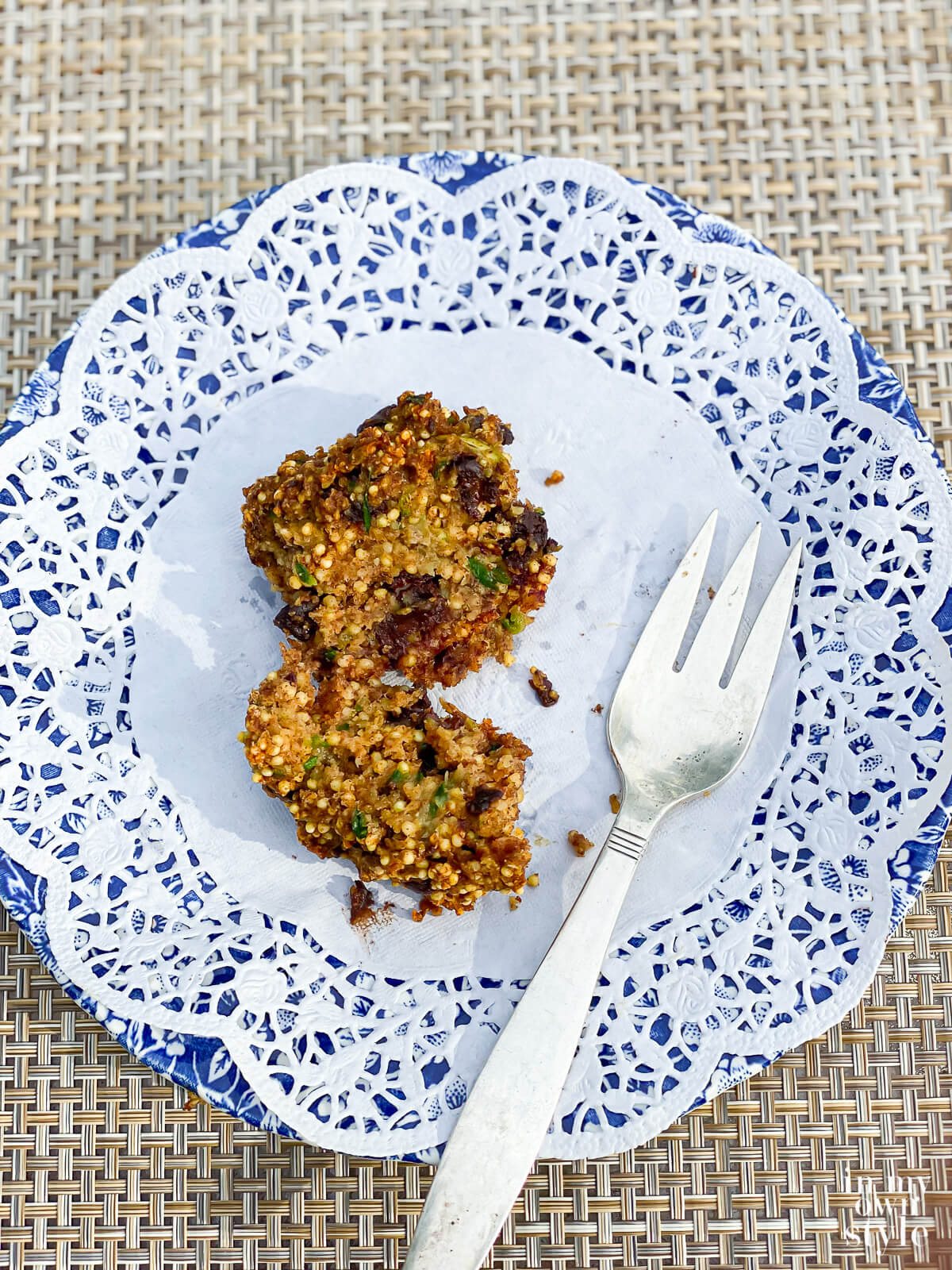An oil-free zucchini muffin with a fork on a plate.