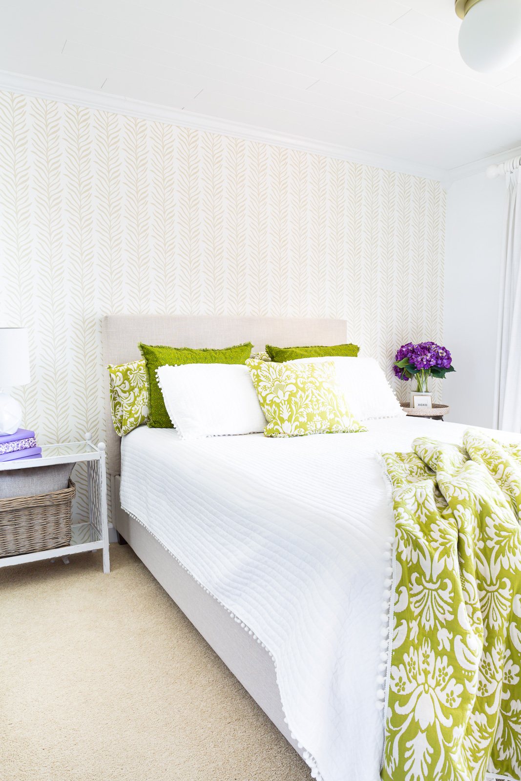 Long view of bedroom after accent wall was covered with Love vs Design wallpaper.