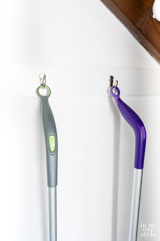 Swiffer mops in a hidden closet