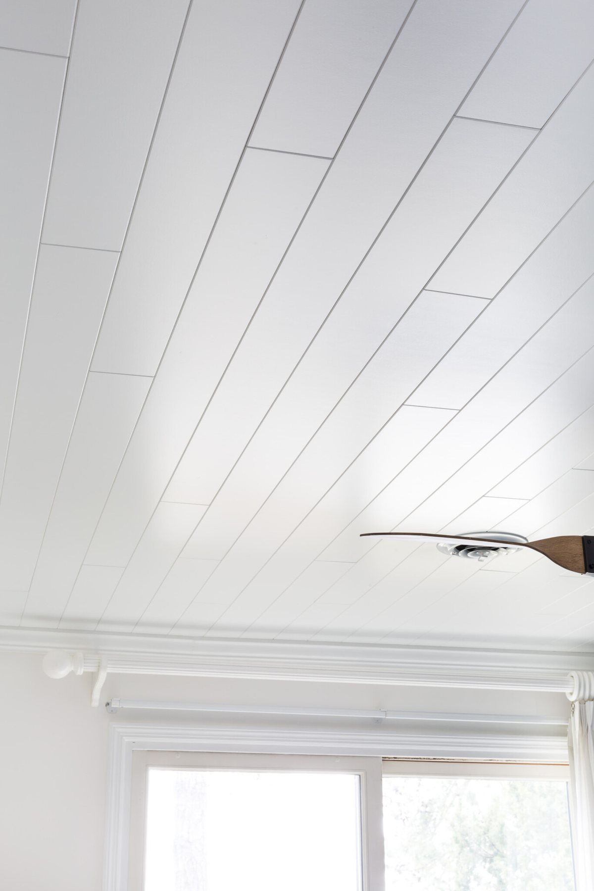 Armstrong WoodHaven Planks in Painted White on a bedroom ceiling.