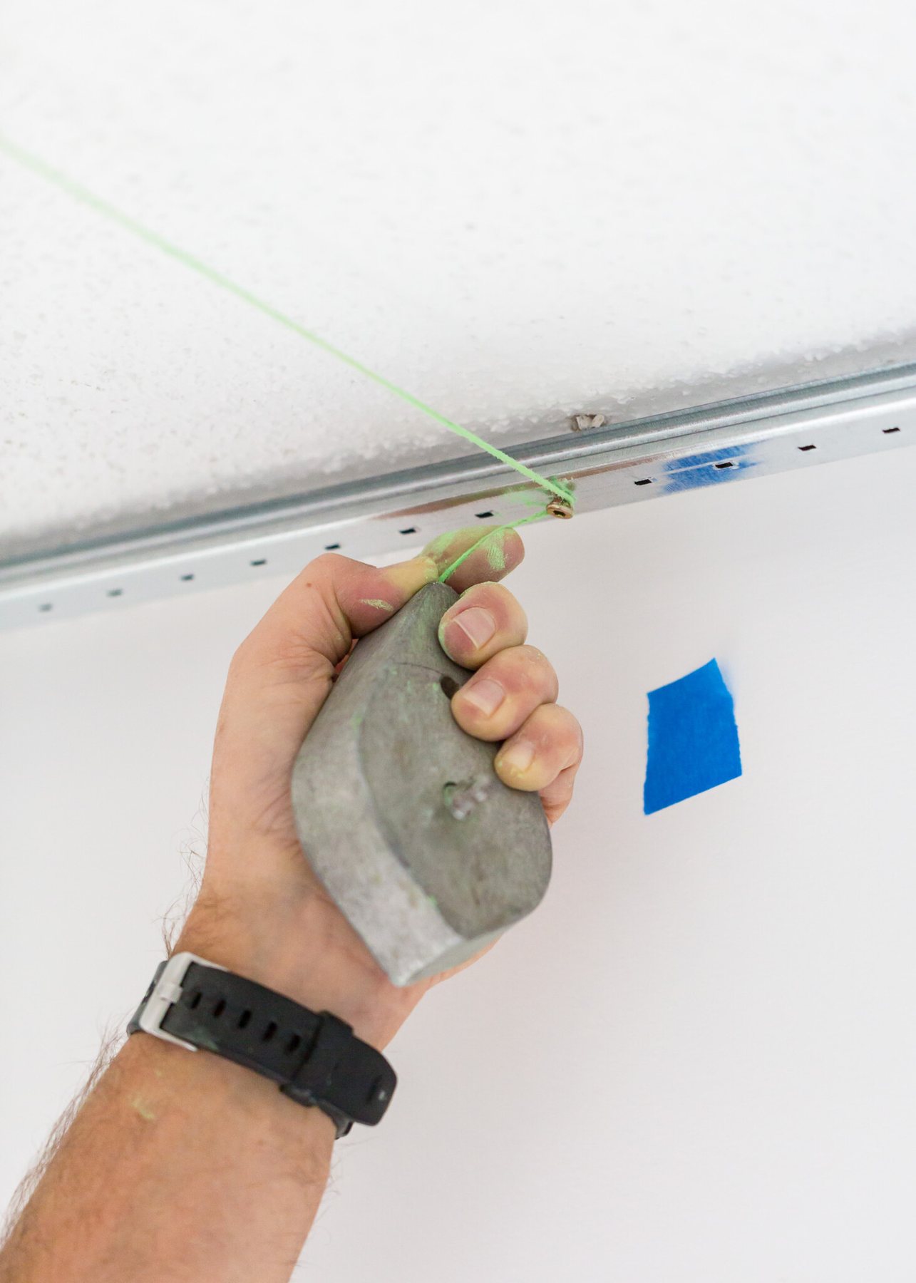 How to snap a chalk line by yourself when installing a plank ceiling.