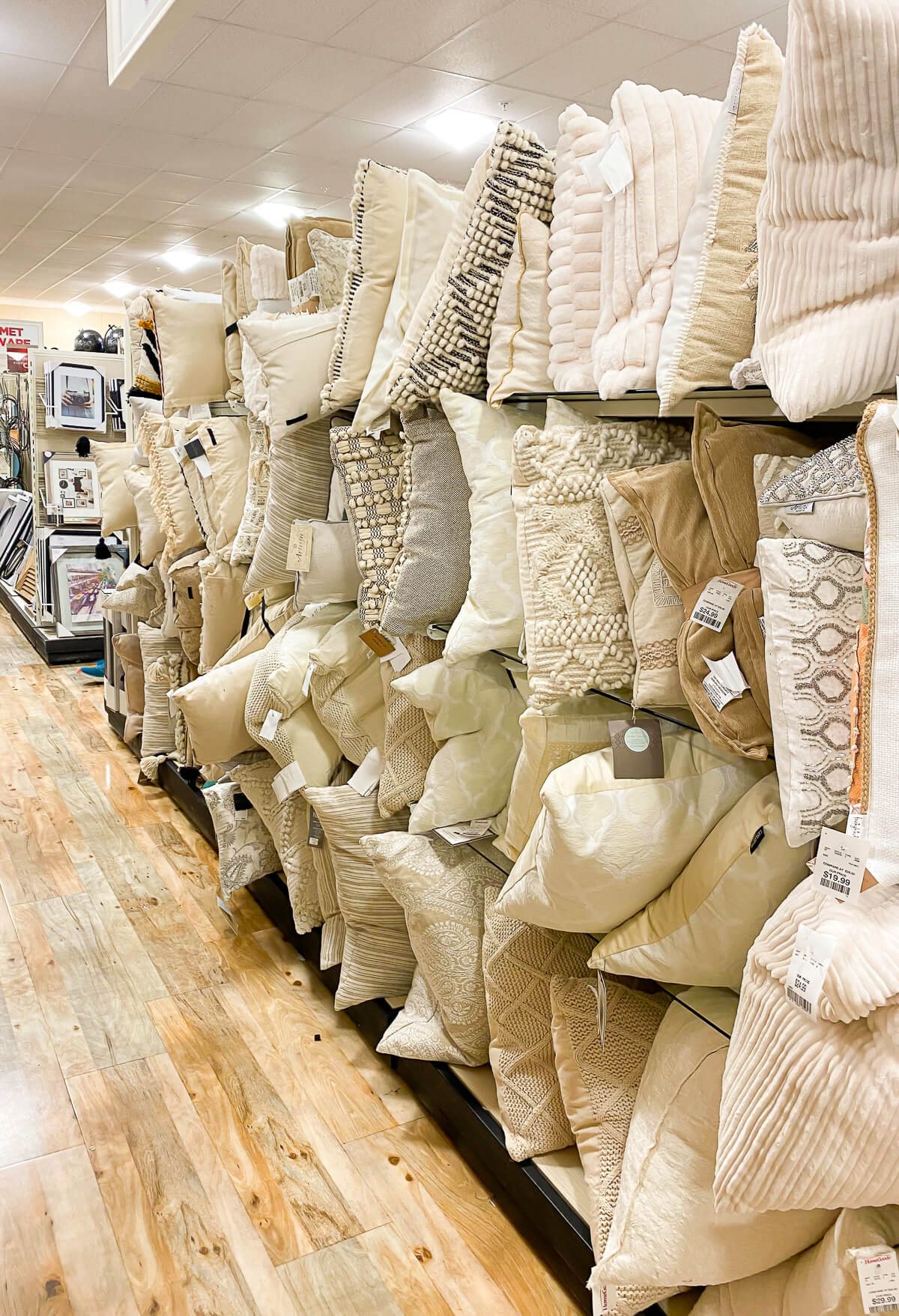 Neutral color throw pillows on display at Home Goods