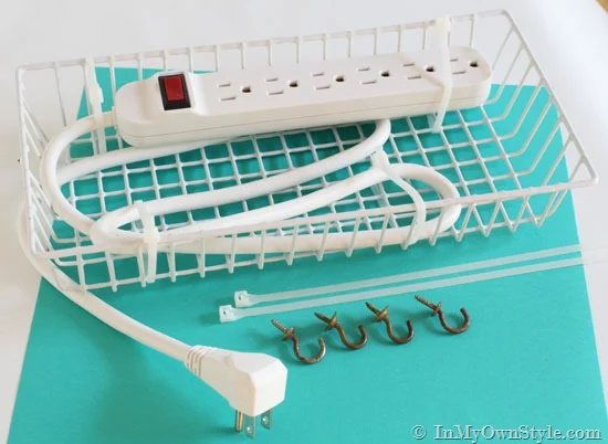 power strip in white wired basket