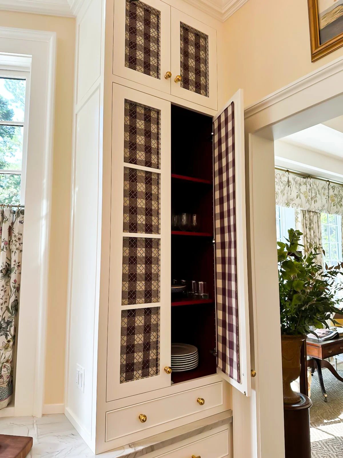 fabric covered glass fronted cabinets in kitchen at the SL Idea House 2025