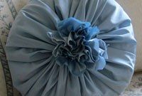 Crafting Elegance: Puddled Drapes and Rosette Pillows