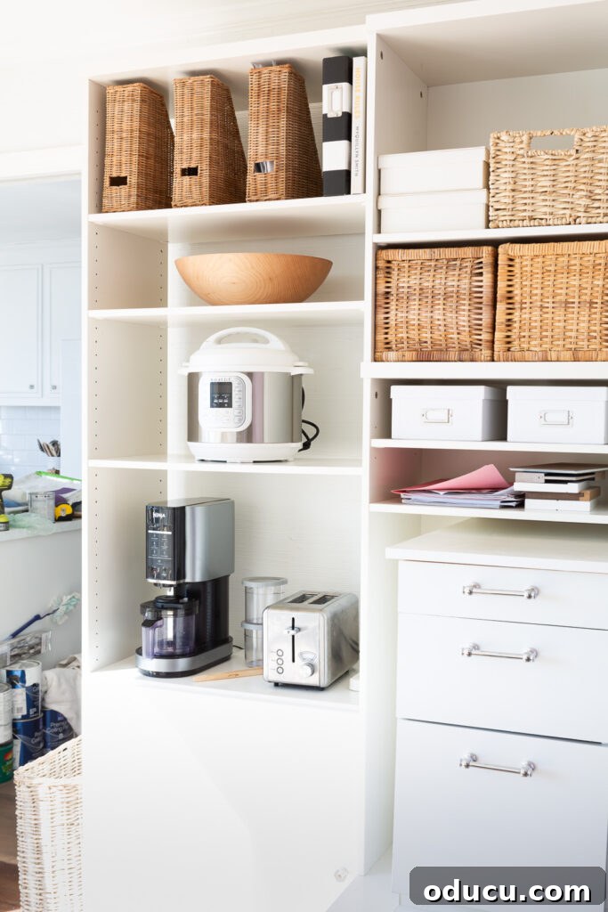 From Spare to Stellar: Room Transformation 18 Vintage IKEA wall unit fitted to make a custom wall unit to act as a pantry using a mis-match of other storage items.